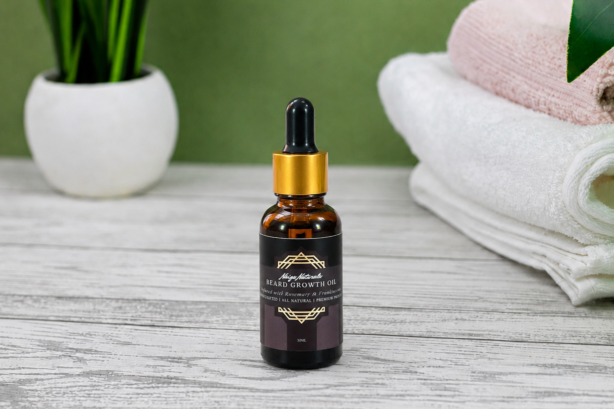 Bottle of beard growth oil with dropper on a wooden surface with towels and plants in the background